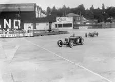 Frazer-Nash of RT Grogan leading Jack Lemon Burton's Bugatti T37, BARC meeting, Brooklands, 1933. Artist: Bill Brunell
