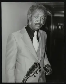 Freddie Green, guitarist with Count Basie's Orchestra, at the Royal Festival Hall, London, 1980. Creator: Denis Williams
