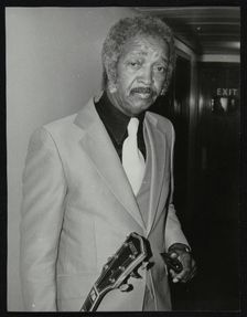 Freddie Green, guitarist with Count Basie's Orchestra, at the Royal Festival Hall, London, 1980. Creator: Denis Williams
