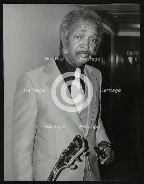 Freddie Green, guitarist with Count Basie's Orchestra, at the Royal Festival Hall, London, 1980. Creator: Denis Williams.