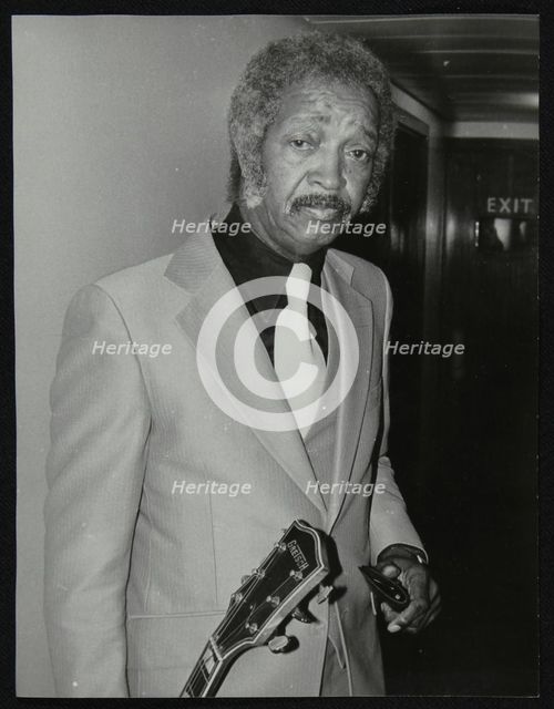 Freddie Green, guitarist with Count Basie's Orchestra, at the Royal Festival Hall, London, 1980. Creator: Denis Williams.