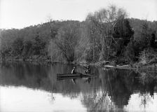 Frederick George Walker and boy in a row boat (possibly Coomera River), c1900s.. Creator: Robert Augustus Henry L'Estrange