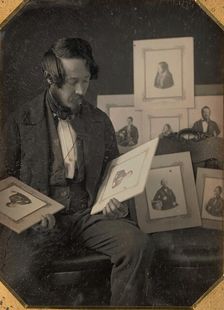 Frederick Langenheim Looking at Talbotypes, ca. 1849-51. Creators: William Langenheim, Frederick Langenheim