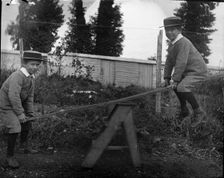 Frederick Robert L'Estrange on a see saw, c1895. Creator: Robert Augustus Henry L'Estrange