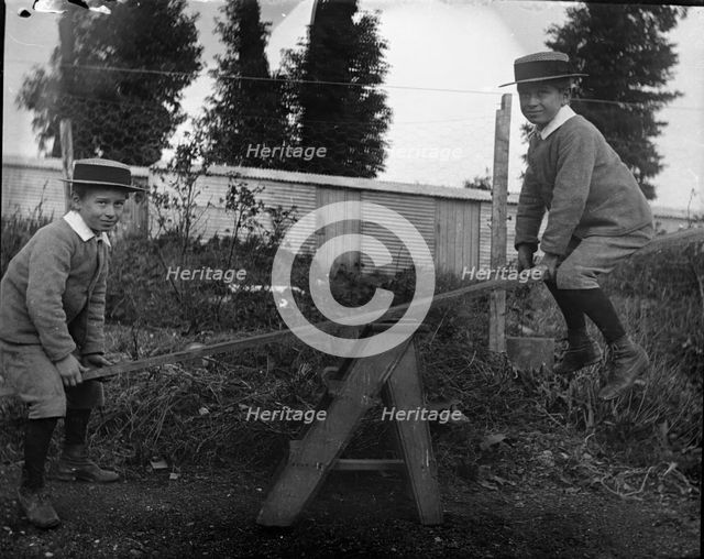 Frederick Robert L'Estrange on a see saw, c1895. Creator: Robert Augustus Henry L'Estrange.