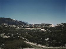 Freight train with two helper engines climbing the steep grade of Cajon Pass (westbound), CA., 1943. Creator: Jack Delano