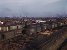 Freight cars being maneuvered in a Chicago and North Western railroad yard, Chicago, Ill., 1942. Creator: Jack Delano