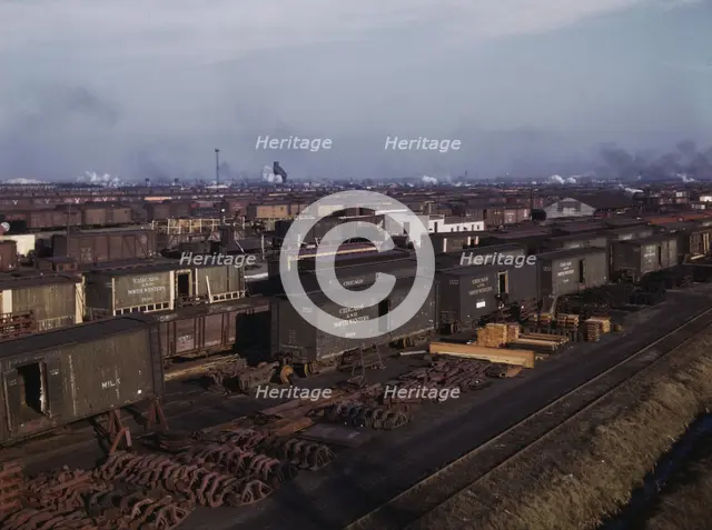 Freight cars being maneuvered in a Chicago and North Western railroad yard, Chicago, Ill., 1942. Creator: Jack Delano.