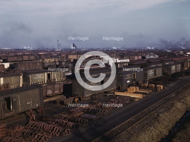 Freight cars being maneuvered in a Chicago and North Western railroad yard, Chicago, Ill., 1942. Creator: Jack Delano.