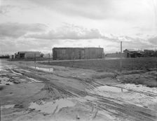 Freightcar converted into home in "Little Oklahoma", California, 1936. Creator: Dorothea Lange