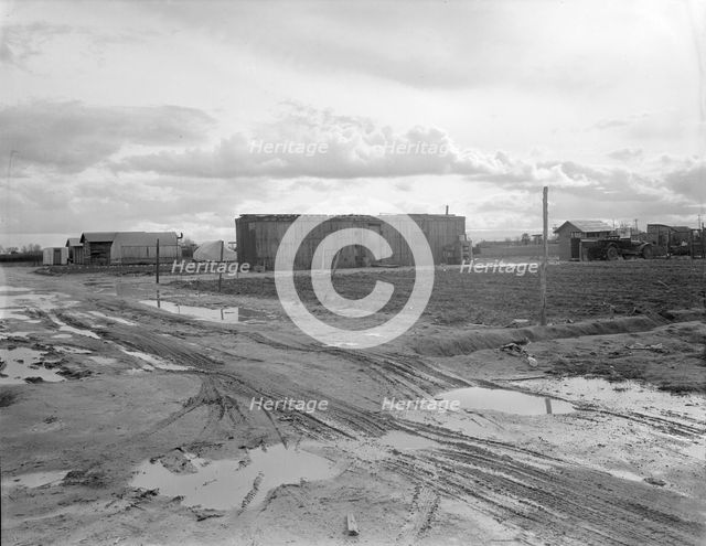 Freightcar converted into home in "Little Oklahoma", California, 1936. Creator: Dorothea Lange.