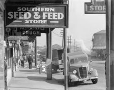 French market sidewalk scene, Waterfront in New Orleans, Louisiana, 1935. Creator: Walker Evans
