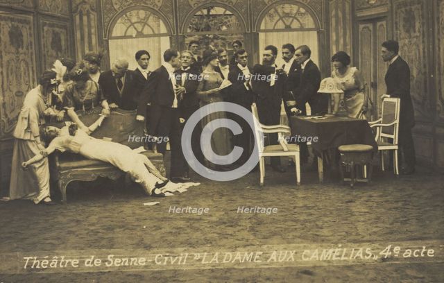 French or Belgian prisoners of war, some in drag, posing on stage during a crowded scene..., [1918?] Creator: Unknown.