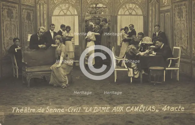 French or Belgian prisoners of war, some in drag, posing on stage during a crowded scene..., (1918?) Creator: Unknown.
