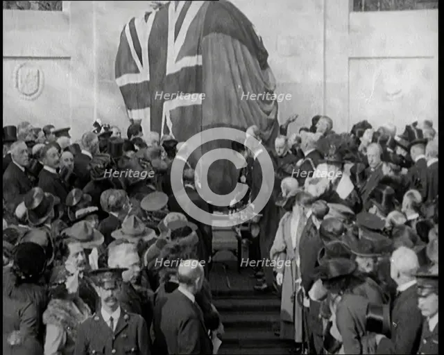 French and British Crowd Watching as a Union Flag and Tricolore Are Removed to Reveal..., 1920. Creator: British Pathe Ltd.