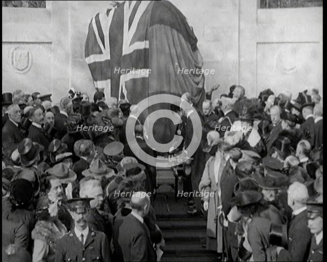 French and British Crowd Watching as a Union Flag and Tricolore Are Removed to Reveal..., 1920. Creator: British Pathe Ltd.