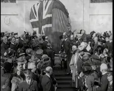 French and British Crowd Watching as a Union Flag and Tricolore Are Removed to Reveal..., 1920. Creator: British Pathe Ltd