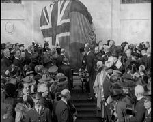 French and British Crowd Watching as a Union Flag and Tricolore Are Removed to Reveal..., 1920. Creator: British Pathe Ltd