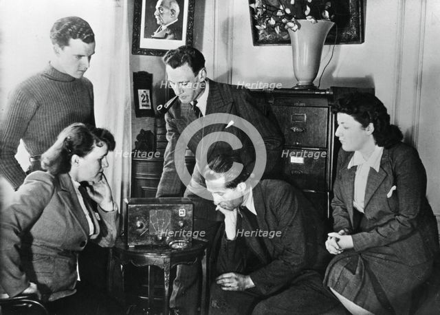 French citizens listening to a broadcast by Vichy deputy premier Admiral Darlan, 23 May, 1941. Artist: Unknown
