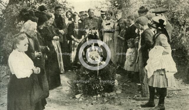 French civilians at the grave of a soldier, 1914, (c1920). Creator: Unknown.