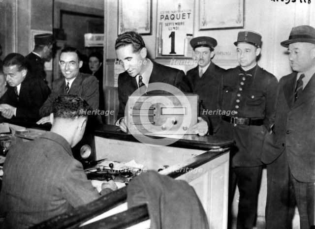 French Jews forced to hand in their radio sets to the police, occupied Paris, September 1941. Artist: Unknown