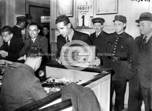 French Jews forced to hand in their radio sets to the police, occupied Paris, September 1941. Artist: Unknown