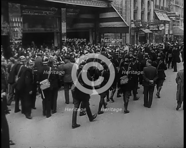 French Police Checking People's Papers Outside a Cafe in Paris, 1940. Creator: British Pathe Ltd.