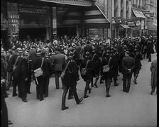 French Police Checking People's Papers Outside a Cafe in Paris, 1940. Creator: British Pathe Ltd
