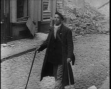 French Refugee Walking Through Demolished Town, 1940. Creator: British Pathe Ltd