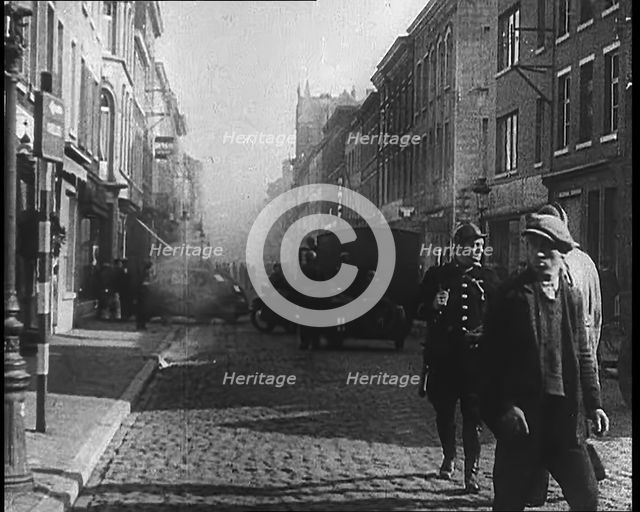 French Refugees Walking Through a Ruined Town, 1940. Creator: British Pathe Ltd.