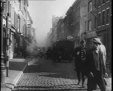 French Refugees Walking Through a Ruined Town, 1940. Creator: British Pathe Ltd