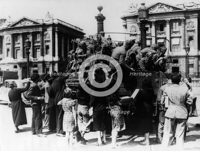 French street sellers offering souvenirs to a truckload of German soldiers, Paris, 27 July 1940. Artist: Unknown
