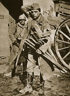 French soldier with wooden crosses to be placed on temporary graves, World War I, c1914-c1918