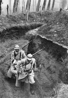 French soldiers carrying a wounded companion from the front, First World War, 1917, (c1920)