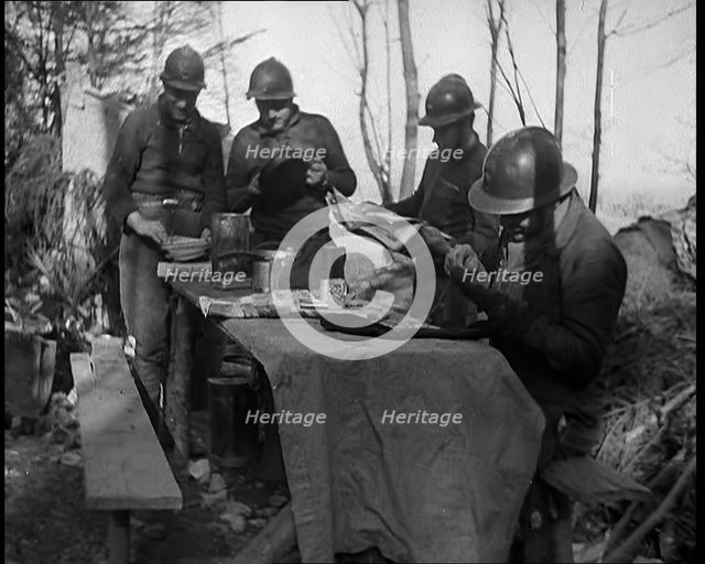 French Soldiers Eating a Meal in a Dug Out, 1940. Creator: British Pathe Ltd.