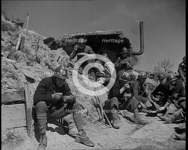 French Soldiers Eating a Meal in a Dug Out, 1940. Creator: British Pathe Ltd.