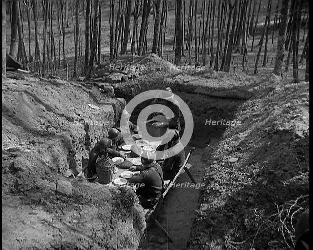 French Soldiers Eating a Meal in a Dug Out, 1940. Creator: British Pathe Ltd.