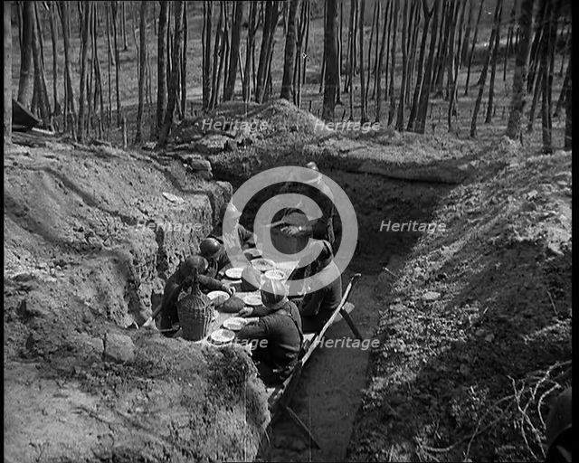 French Soldiers Eating a Meal in a Dug Out, 1940. Creator: British Pathe Ltd.
