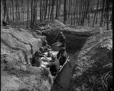 French Soldiers Eating a Meal in a Dug Out, 1940. Creator: British Pathe Ltd