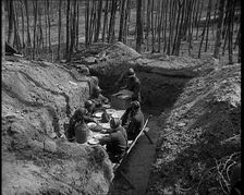 French Soldiers Eating a Meal in a Dug Out, 1940. Creator: British Pathe Ltd
