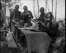 French Soldiers Eating a Meal in a Dug Out, 1940. Creator: British Pathe Ltd