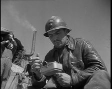 French Soldiers Eating a Meal in a Dug Out, 1940. Creator: British Pathe Ltd