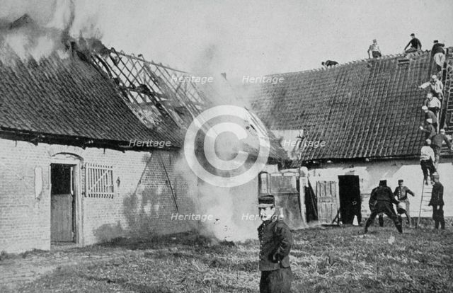 French soldiers fight a fire started by German incendiary bombs, Artois, World War I, 1915. Artist: Unknown