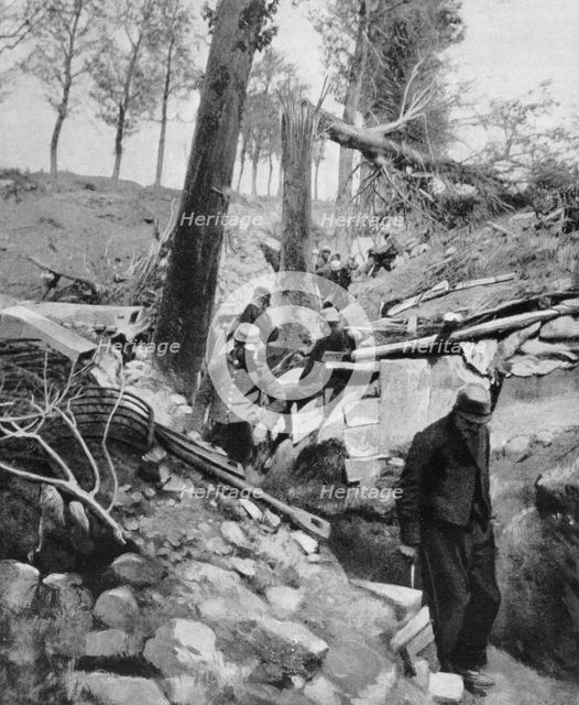 French soldiers going through a trench after a heavy German bombardment, World War I, 1915. Artist: Unknown