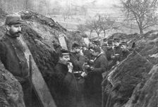 French soldiers in the trenches eating their rations, France, 1915