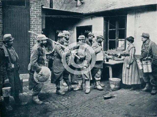 French soldiers returning from the trenches make a halt for refreshment, c1914. Artist: Unknown