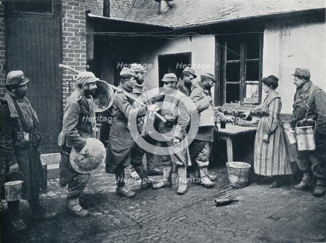 French soldiers returning from the trenches make a halt for refreshment, c1914. Artist: Unknown