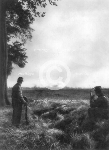 French soldiers watching artillery fire, 1st Battle of the Marne, France, 5-12 September 1914. Artist: Unknown