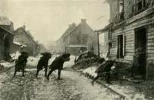French troops crossing a village street under German fire, First World War, 1914-1915, (c1920). Creator: Unknown