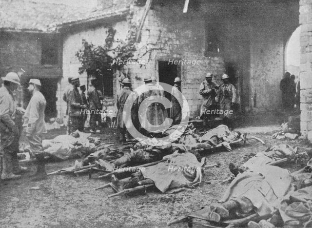 'French wounded being removed during an attack to a farm in the rear of the lines', 1915. Artist: Unknown.